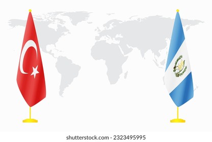 Turkey and Guatemala flags for official meeting against background of world map.