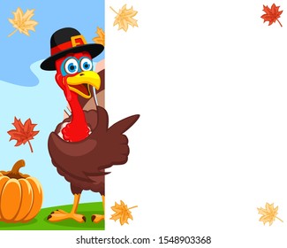 Turkey in a hat points a wing to a white sheet, a place for text. Thanksgiving day.