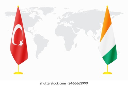 Turkey and Ivory Coast flags for official meeting against background of world map.