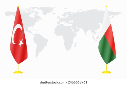 Turkey and Madagascar flags for official meeting against background of world map.
