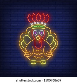 Turkey wearing Indian chief headdress neon sign. Thanksgiving Day, animal design. Night bright neon sign, colorful billboard, light banner. Vector illustration in neon style.