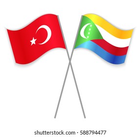 Turkish and Comoran crossed flags. Turkey combined with Comoros isolated on white. Language learning, international business or travel concept.