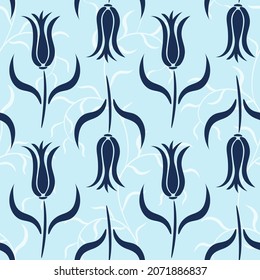 Turkish floral hand drawn seamless pattern with blue tulips and plants silhouettes on the light blue background. Great for wallpaper, fabric, packaging.