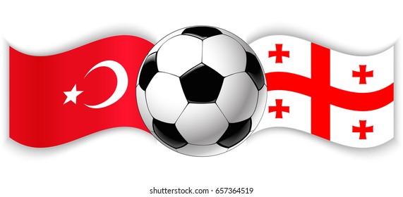 Turkish and Georgian wavy flags with football ball. Turkey combined with Georgia isolated on white. Football match or international sport competition concept.