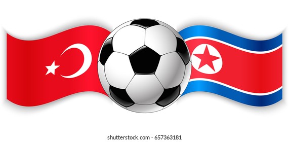 Turkish and North Korean wavy flags with football ball. Turkey combined with North Korea isolated on white. Football match or international sport competition concept.
