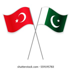 Turkish and Pakistani crossed flags. Turkey combined with Pakistan isolated on white. Language learning, international business or travel concept.