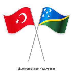 Turkish and Solomon Island crossed flags. Turkey combined with Solomon Islands isolated on white. Language learning, international business or travel concept.