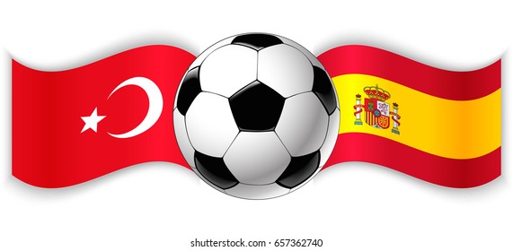 Turkish and Spanish wavy flags with football ball. Turkey combined with Spain isolated on white. Football match or international sport competition concept.