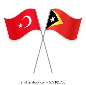 Turkish and Timorese crossed flags. Turkey combined with East Timor isolated on white. Language learning, international business or travel concept.