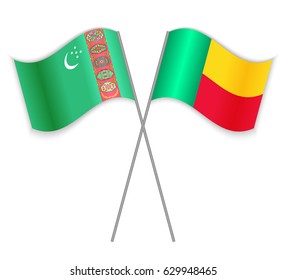 Turkmen and Beninese crossed flags. Turkmenistan combined with Benin isolated on white. Language learning, international business or travel concept.