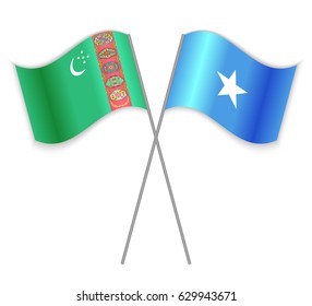 Turkmen and Somali crossed flags. Turkmenistan combined with Somalia isolated on white. Language learning, international business or travel concept.