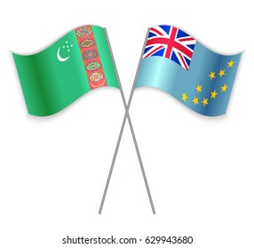 Turkmen and Tuvaluan crossed flags. Turkmenistan combined with Tuvalu isolated on white. Language learning, international business or travel concept.