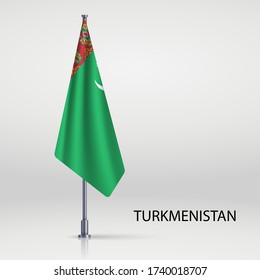 Turkmenistan hanging flag on flagpole