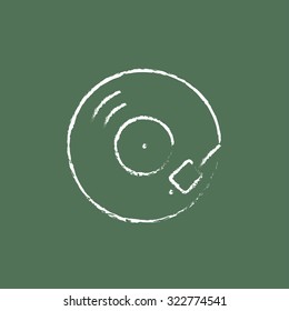 Turntable hand drawn in chalk on a blackboard vector white icon isolated on a green background.