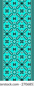 Turquoise dupatta with geometric patterns featuring black and white motifs.