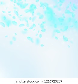 Turquoise flower petals falling down. Artistic romantic flowers gradient. Flying petal on blue sky square background. Love, romance concept. Bold wedding invitation.