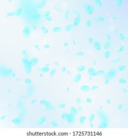 Turquoise flower petals falling down. Positive romantic flowers falling rain. Flying petal on blue sky square background. Love, romance concept. Beautiful wedding invitation.
