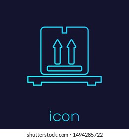 Turquoise line Cardboard boxes on pallet icon isolated on blue background. Closed carton delivery packaging box with fragile signs.  Vector Illustration