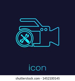 Turquoise line Video camera with screwdriver and wrench icon isolated on blue background. Adjusting, service, setting, maintenance, repair, fixing.  Vector Illustration