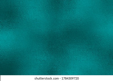 Turquoise metallic effect. Texture shine foil. Background with glitterer metal effect. Blue green surface. Backdrop glitter mint metal plate. Metallic texture foil for design invitation, cards, prints