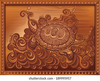 Turtle carved on wood panel.