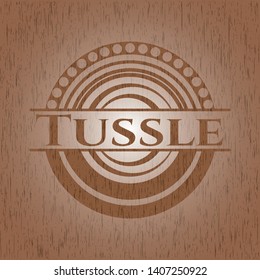 Tussle badge with wooden background