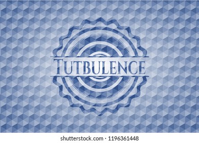 Tutbulence blue badge with geometric pattern.