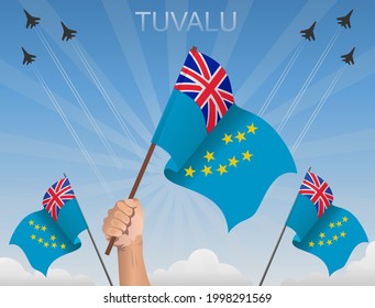 Banderas de Tuvalu ondeando bajo el cielo azul