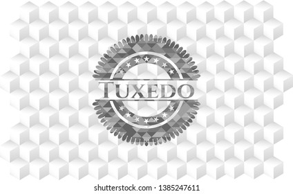 Tuxedo grey badge with geometric cube white background