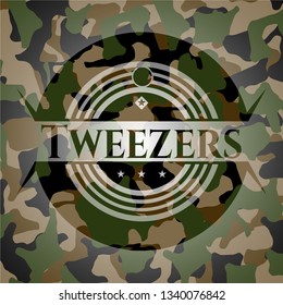 Tweezers on camo texture