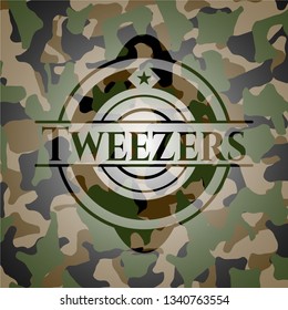 Tweezers on camo texture