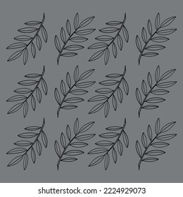 Twigs with narrow leaves on a gray background