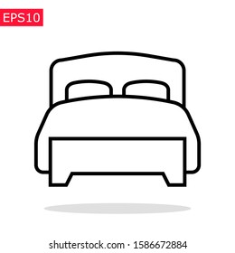 Twin bed icon with soft blanket and pillows. Isolated vector sign. Bedroom pictogram.