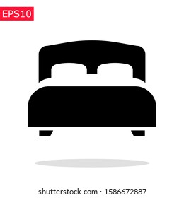 Twin bed icon with soft blanket and pillows. Isolated vector sign. Bedroom spictogram.