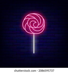 Twisted pink candy neon icon. Sweet shop logo. Night bright signboard on brick wall background. Luminous label. Outer glowing effect emblem. Editable stroke. Vector stock illustration