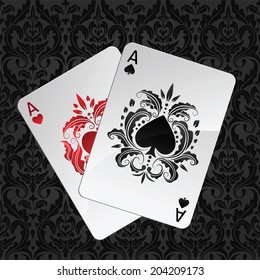two aces playing cards on black seamless damask pattern(spades overlies)