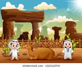 Two arab boys with camels in the desert