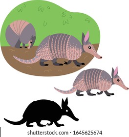 Dos armadillos caminando en el suelo contra el fondo de un arbusto
