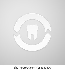 Two arrows in a circle around the tooth