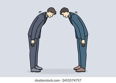 Two asian business men bow in greeting and say conishua during tailoring meeting to sign contract. Traditional greeting for chinese or japanese businessmen at professional or corporate conference