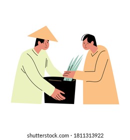Two asian men farmers in special costumes picking rice and putting in basket