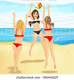 two athletic volleyball players are blocking ball while another woman jumping doing attack 