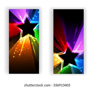 Two banners with black star with rainbow rays.