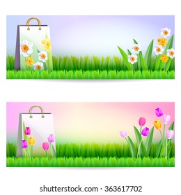 Two banners with shopping bags. Right on the banners are spring flowers.