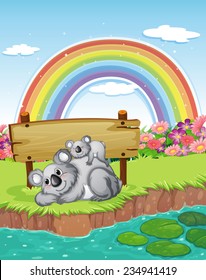 Two bears near the empty signboard with a rainbow in the sky