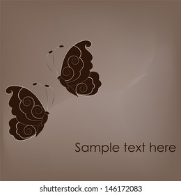 Two beautiful butterflies on brown background