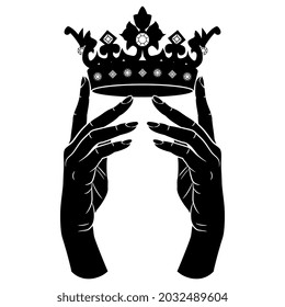Two beautiful female hands holding royal crown adorned with gems. Creative concept. Black and white negative silhouette.