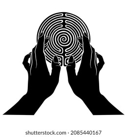 Two beautiful female hands holding a round spiral maze or labyrinth symbol. Ariadne. Creative concept. Black and white silhouette.