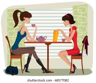 Two beautiful women in cafe