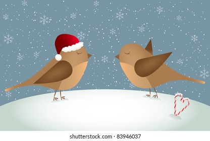 Two birds in love standing in snowy landscape